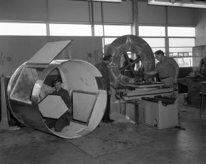 Basil Gum, Tony Haerl, and Herb Hanes construct casings for the 140-foot telescope's receiver