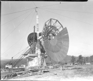 Attaching the surface panels to the 140-foot telescope