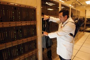 Technician working on ALMA's correlator