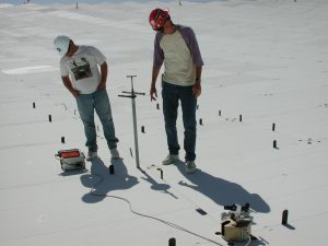 elescope Technicians J. D. Nelson and Nathan Sharp measure positions of GBT surface panels