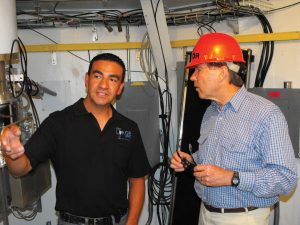 U.S. Senator Tom Udall and NRAO employee Eric Chavez