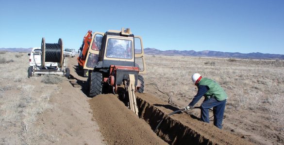 Digging trenches for fiber optic lines at The VLA