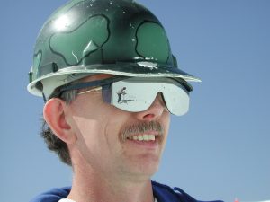 Telescope technician wearing safety sunglasses