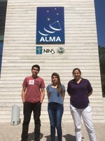 group photo of students and scientists in front of Alma and NINS sign