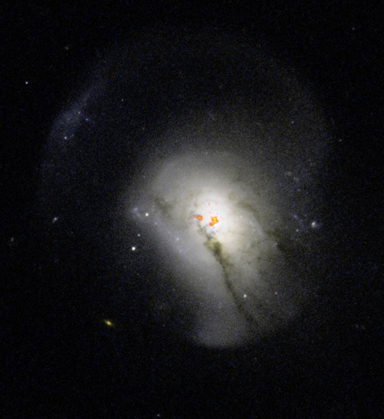 composite image of galaxy 0570 showing compact gas near the center of the galaxu