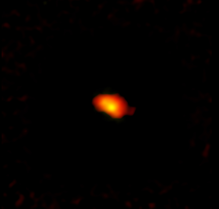 Galaxy shown in red/orange radio light as a small bean shape